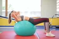 The stability ball hip thrust is a great way to target your glutes! (Image via pexels/Andrea Piacquadio)
